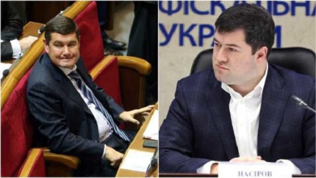 Народный депутат Украины Александр Онищенко в зале Верховной Рады и глава ГФС Роман Насиров в пиджаке сидит за столом на пресс-конференции Народный депутат Украины Александр Онищенко в зале Верховной Рады и глава ГФС Роман Насиров в пиджаке сидит за столом на пресс-конференции